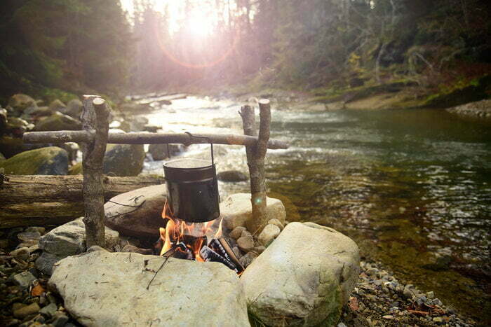 Cooking,on,bonfire.,campfire,near,mountain,river.,camping,fire,on
