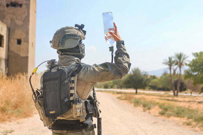 Soldier is Holding Hydration Bladder