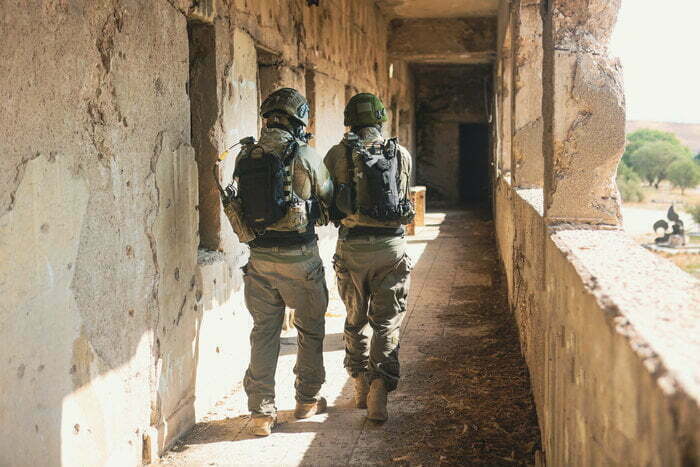 Two Soldiers with tactical rifle backpacks