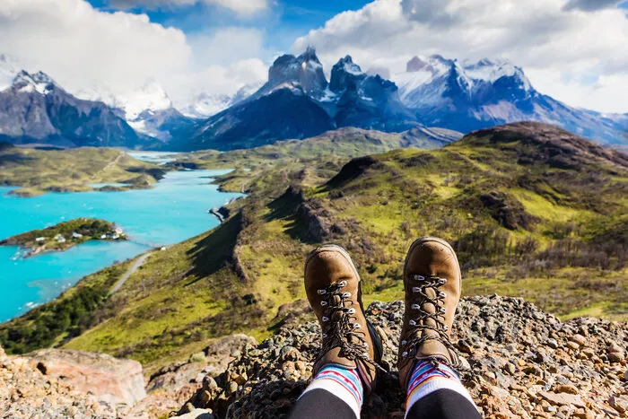 hiking boots with a view of the mountains